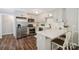 Modern kitchen featuring stainless steel appliances, quartz countertops, and ample cabinet space at 10206 Washam Potts Rd, Cornelius, NC 28031