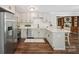 Modern kitchen featuring stainless steel appliances, quartz countertops, and ample cabinet space at 10206 Washam Potts Rd, Cornelius, NC 28031