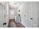 Functional mudroom featuring a utility sink, bright windows, and plenty of storage at 10206 Washam Potts Rd, Cornelius, NC 28031