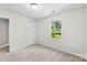 Carpeted bedroom provides natural light through a single window at 109 Landon Ct, Shelby, NC 28152