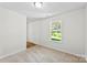 Neutral bedroom featuring carpeted flooring and a bright window at 109 Landon Ct, Shelby, NC 28152