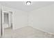 Bedroom featuring carpet flooring, neutral wall paint, and multiple entryways at 109 Landon Ct, Shelby, NC 28152