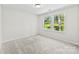 Bright bedroom features plush carpeting and sunlit windows with views of the outdoors at 109 Landon Ct, Shelby, NC 28152