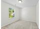 Neutral bedroom offers comfortable carpeting and a bright window at 109 Landon Ct, Shelby, NC 28152