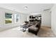 Open-concept living room features a sectional sofa, and abundant natural light at 109 Landon Ct, Shelby, NC 28152