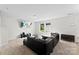 Spacious living room with comfortable seating, media center, and bright windows at 109 Landon Ct, Shelby, NC 28152