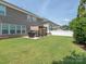A well-maintained backyard features a patio area with a grill and pergola, perfect for outdoor entertaining at 1109 Saratoga Blvd, Indian Trail, NC 28079