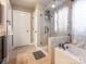 A bathroom featuring a glass shower, tub, tile floor and walls, as well as a separate toilet area at 1109 Saratoga Blvd, Indian Trail, NC 28079