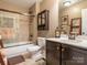 Cozy bathroom featuring a shower-tub combo with tile surround and modern fixtures at 1109 Saratoga Blvd, Indian Trail, NC 28079