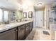 Bathroom with granite counters, double sinks, dark cabinets, a glass enclosed shower and tile flooring at 1109 Saratoga Blvd, Indian Trail, NC 28079