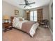 Comfortable bedroom with a queen-size bed, soft lighting, and warm neutral tones at 1109 Saratoga Blvd, Indian Trail, NC 28079