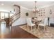 Dining room features a wooden table, seating for four, and decorative lighting at 1109 Saratoga Blvd, Indian Trail, NC 28079