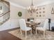 Dining room features a wooden table, seating for four, and decorative lighting at 1109 Saratoga Blvd, Indian Trail, NC 28079