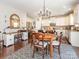 Open concept kitchen with white cabinets, stainless steel appliances, and eat-in dining area at 1109 Saratoga Blvd, Indian Trail, NC 28079