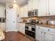 Kitchen featuring granite countertops, stainless steel appliances, and white cabinetry at 1109 Saratoga Blvd, Indian Trail, NC 28079