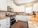 Well-lit kitchen with stainless steel appliances and granite countertops at 1109 Saratoga Blvd, Indian Trail, NC 28079