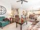 Open-concept living area with hardwood floors, comfortable seating, and a view of the kitchen at 1109 Saratoga Blvd, Indian Trail, NC 28079