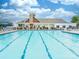 Large community swimming pool with lounge chairs, tables, and a clubhouse at 1109 Saratoga Blvd, Indian Trail, NC 28079
