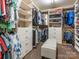 A well-organized walk-in closet with shelving, drawers, hanging rods, and an ottoman at 1109 Saratoga Blvd, Indian Trail, NC 28079