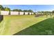 Well-maintained backyard with lush green lawn and secure fencing at 1120 Idyllic Ln, Waxhaw, NC 28173