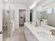Bathroom featuring double sinks, shower with glass enclosure, and walk-in closet at 1120 Idyllic Ln, Waxhaw, NC 28173
