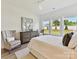 Bright bedroom with ample natural light showcasing a dresser and view to yard at 1120 Idyllic Ln, Waxhaw, NC 28173