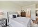 Bright bedroom with ample natural light showcasing neutral decor and an ensuite bathroom at 1120 Idyllic Ln, Waxhaw, NC 28173
