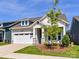Charming single-Gathering home showcasing a well-maintained lawn and attached two-car garage at 1120 Idyllic Ln, Waxhaw, NC 28173