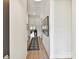 Long hallway with luxury vinyl plank flooring and neutral paint at 1120 Idyllic Ln, Waxhaw, NC 28173