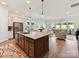Open concept with kitchen island flowing into a bright living area with large windows and natural light at 1120 Idyllic Ln, Waxhaw, NC 28173