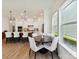 Open concept kitchen featuring pendant lights over island and dining area with windows at 1120 Idyllic Ln, Waxhaw, NC 28173