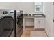 Modern laundry room featuring stainless steel washer and dryer at 1120 Idyllic Ln, Waxhaw, NC 28173