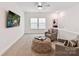Cozy living room featuring neutral decor, a ceiling fan, and ample natural light at 1120 Idyllic Ln, Waxhaw, NC 28173
