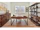 Functional home office with stylish desk, shelving, and ample storage space at 1120 Idyllic Ln, Waxhaw, NC 28173