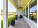 Covered outdoor patio with ceiling fan and view of the backyard at 1120 Idyllic Ln, Waxhaw, NC 28173