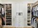 Organized walk-in closet with shelving and hanging racks for optimal storage at 1120 Idyllic Ln, Waxhaw, NC 28173