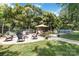 Backyard view featuring a patio with outdoor seating and an above ground pool at 1219 Flowe Dr, Matthews, NC 28104