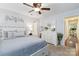 Comfortable bedroom with ample closet space and ensuite bathroom featuring modern decor and neutral color palette at 1219 Flowe Dr, Matthews, NC 28104