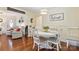 Dining room with wood floors has a large bright window that lets in lots of natural light at 1219 Flowe Dr, Matthews, NC 28104