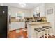 Well-maintained kitchen with white cabinets, stainless steel appliances, and granite countertops at 1219 Flowe Dr, Matthews, NC 28104