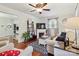 Spacious living room featuring hardwood floors, a fireplace, and comfortable seating at 1219 Flowe Dr, Matthews, NC 28104