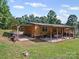 Back of house with a covered carport and a large covered deck at 130 Benton Rd, Kings Mountain, NC 28086