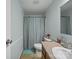 This features a clean bathroom with a shower-tub combination, a blue shower curtain, and a vanity with storage space at 130 Benton Rd, Kings Mountain, NC 28086