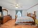 Cozy bedroom featuring wood flooring, a classic wood bed frame, and a matching dresser at 130 Benton Rd, Kings Mountain, NC 28086
