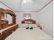 Traditional bedroom features a queen sized bed, ceiling fan, and plenty of space for storage with a large dresser at 130 Benton Rd, Kings Mountain, NC 28086