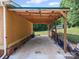 Covered carport, providing shelter for vehicles and additional storage at 130 Benton Rd, Kings Mountain, NC 28086