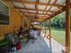Large covered porch with table and chairs and ceiling fan at 130 Benton Rd, Kings Mountain, NC 28086