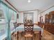Inviting dining area bathed in natural light, featuring wood flooring and classic wood furniture at 130 Benton Rd, Kings Mountain, NC 28086