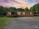 Charming home featuring a covered porch, carport, and a spacious, wooded lot at 130 Benton Rd, Kings Mountain, NC 28086