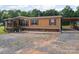 Side view of single-Gathering home featuring a spacious driveway and a covered parking area at 130 Benton Rd, Kings Mountain, NC 28086